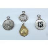 Two 1920s silver fob medals, one for target shooting, a 1930s fire brigade association medal, having