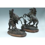 A pair of late 19th / early 20th Century bronzed spelter Marley horses, 44 cm