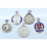 Four silver and enamel target shooting fob medals 1913 to 1957, including Middlesex Small Bore Rifle