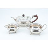 A 1920s Elkington and Co three piece silver tea set, of oblate form raised on four feet, Birmingham,