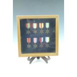 A framed display of replica Second World War British campaign stars