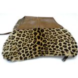 A Victorian British army leopard skin saddle cover