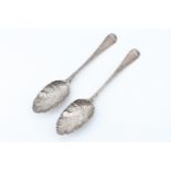 A pair of Georgian and later berry spoons, James Wilks, and Thomas Devonshire & William Watkins,