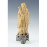 A Japanese soapstone figure of an Immortal, 15 cm