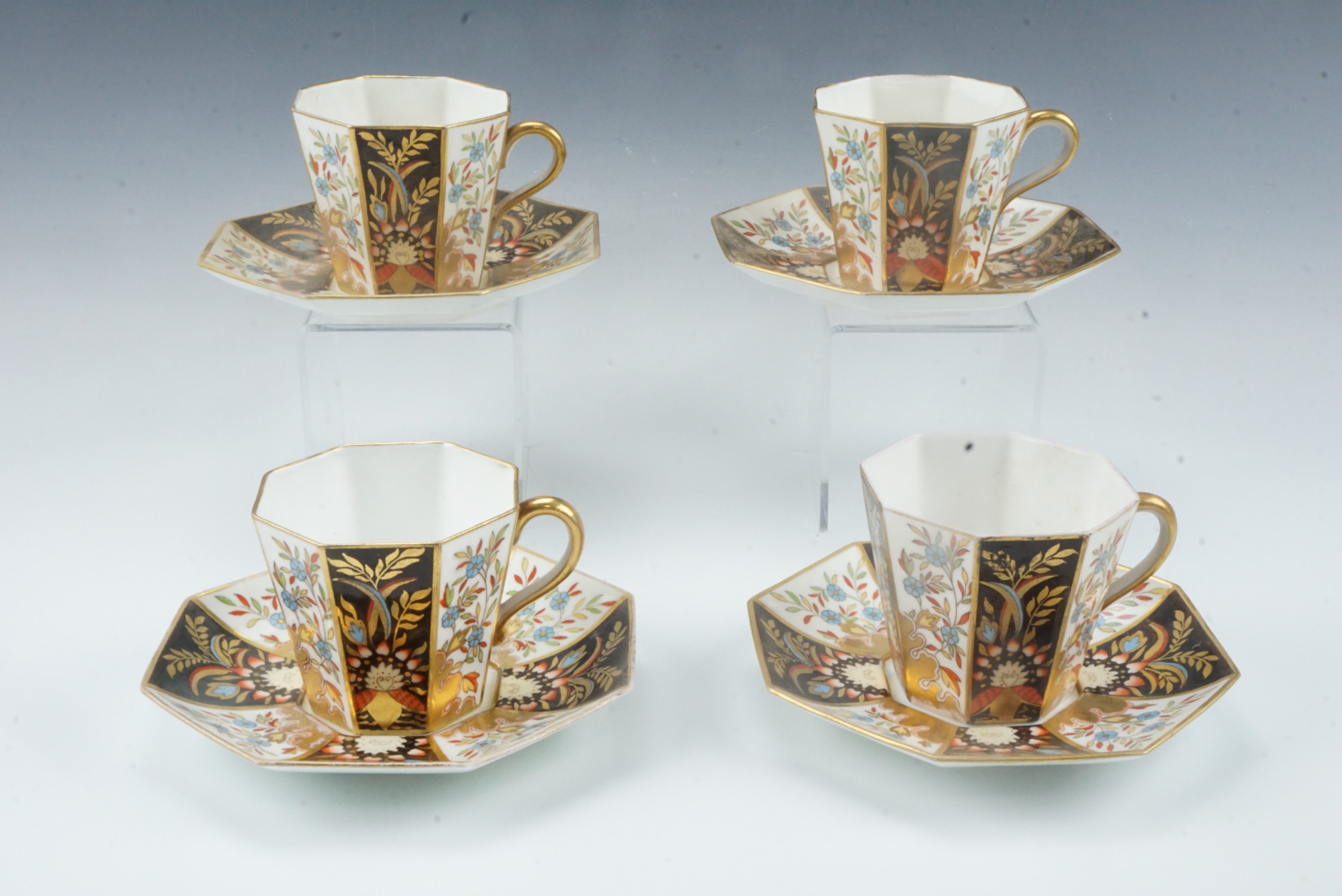 A set of four late 19th Century Wedgwood Imari pattern octagonal section cups and saucers, Y1737