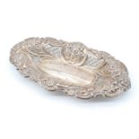 A Victorian pierced silver bon-bon dish, being navette shaped with repousse decoration, John Round &