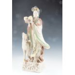 A late 20th Century Chinese painted plaster figure of the immortal Magu holding a basket of