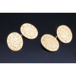 A pair of late Victorian 18 ct gold cufflinks, having floral-engraved oval faces, 10.9 g