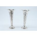 A pair of Edwardian Art Nouveau silver trumpet vases, each having a flamboyant whiplash contoured