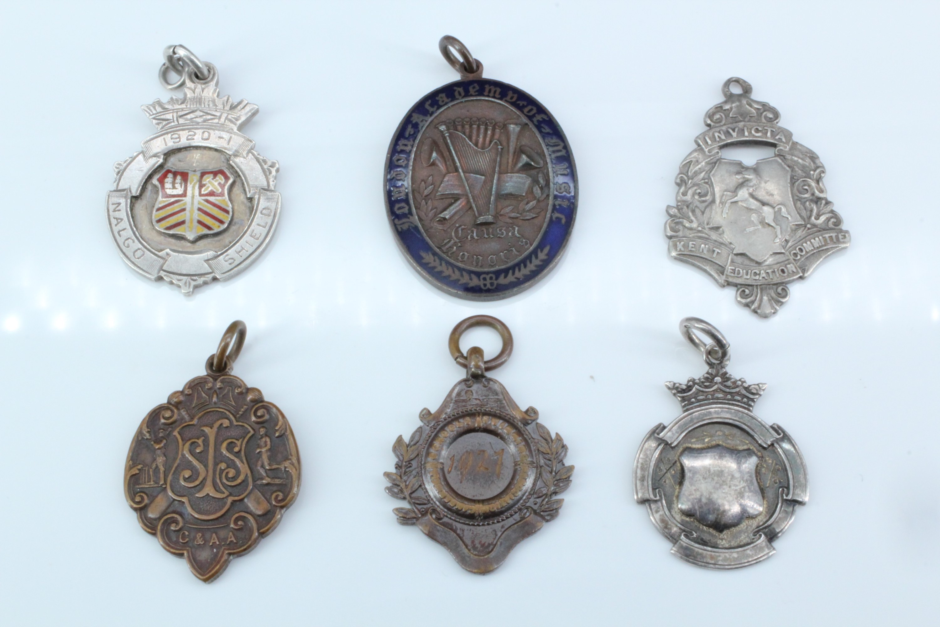 Six early 20th Century silver and bronze presentation fob medals, including a bronze London