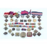 Sundry military medal ribbons and British army rank badges