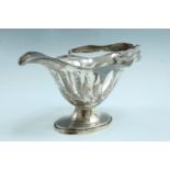 An Edwardian swing handled silver basket, of lobed navette shape and having adorsed pierced sides