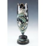 A Victorian elongated oviform black glass vase, hand painted in depiction of wildlife amongst