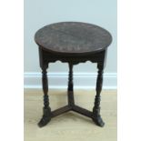 A late 19th / early 20th Century carved oak three-legged occasional table or jardiniere stand, 49 cm