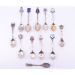 12 silver and enamelled silver souvenir teaspoons, relating to the North East including Newcastle,