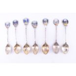 5 silver and 2 white metal souvenir teaspoons, relating to the Red Cross and enamelled in