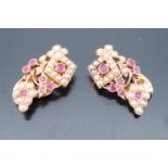 A pair of hand made ruby, spinel and pearl earrings, formed as grape vine openwork with small red