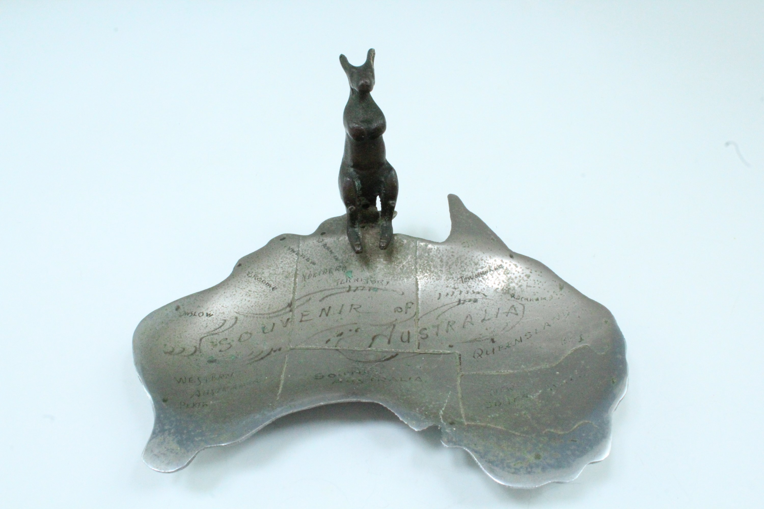 A chrome plated cast brass souvenir pin tray, in the form of the outline of Australia with the