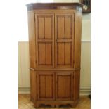 A late Georgian mahogany cross-banded oak floor standing cornet cabinet, 211 cm