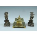 A Victorian cast brass ink well together with a pair of EPBM novelty bookends in the form of