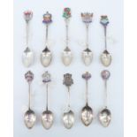 10 silver and enamelled silver souvenir teaspoons, relating to the North West including Carlisle,
