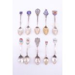 10 silver and enamelled silver souvenir teaspoons, relating to Jersey, Isle Of Man, Isle Of Wight