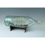 A late 20th Century ship in a bottle, 32 cm