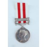 An Indian Mutiny medal with Lucknow clasp impressed to Ens H P Evans, Attd to H M 34th Regt