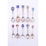 10 enamelled silver souvenir teaspoons, including a "Super mteriam ignis triumphaus" J.K. Smit and