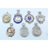 Seven early 20th Century silver and enamelled presentation fob medals, including British Amateur