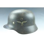 A German Third Reich Luftwaffe Model 1935 steel helmet, having two decals, the shall stamped Q64