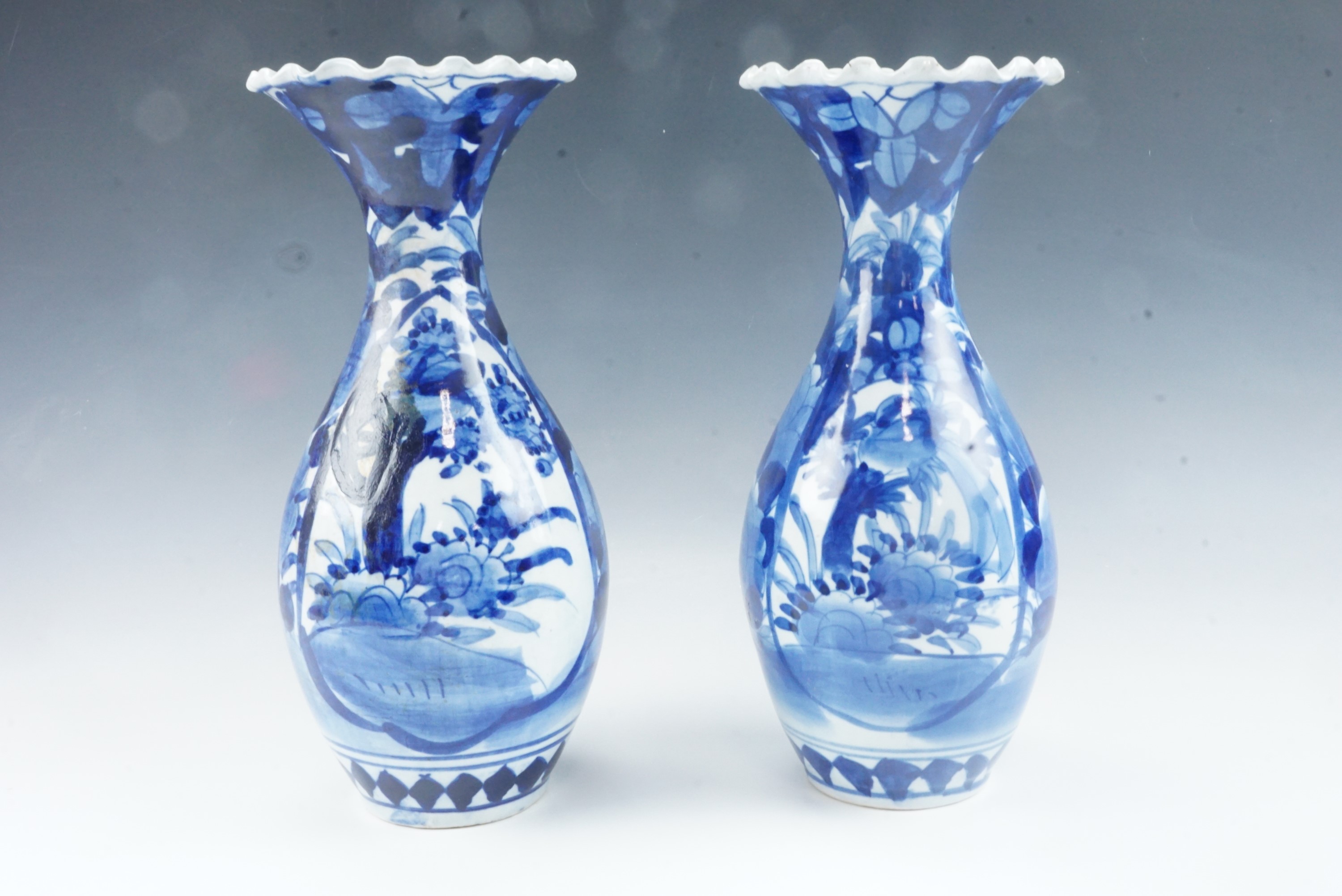 A pair of 20th Century Japanese blue and white porcelain vases, of baluster form with everted