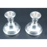 A pair of early 1970s silver candle stands, bearing Birmingham assay office bi-centennial marks, 7