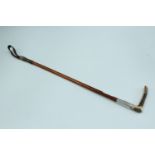 An early 20th Century silver collared riding crop, having an antler handle, the collar engraved "P.