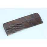 A Second World War escape and evasion wooden comb incorporating a concealed saw blade, 10.5 cm