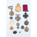 A group of Victorian and later medallions etc, including a brooched livery button, a Daily Mail