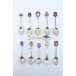 11 silver and enamelled silver souvenir teaspoons, relating to Cornwall including Plymouth, Yarmouth