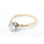 A .5 ct diamond solitaire ring, the brilliant cut stone platinum claw set on an 18 ct yellow metal