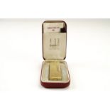 A cased Dunhill "Rollagas" cigarette lighter