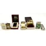 An Elflite "Musical 600" gas cigarette lighter together with six other musical lighters, including