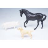 A Beswick horse "Black Beauty", together with a Beswick pig "Champion Hall King" and a golden