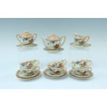 A miniature Japanese egg shell porcelain tea set