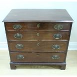 A George III mahogany chest of four long graded drawers, having lion's masks stamped brass backplate