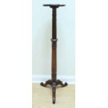 A Victorian carved and turned mahogany tripod torchere, (top a/f), 125 cm