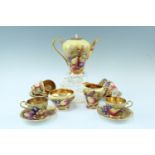 An Aynsley Orchard Gold coffee set, comprising six cups and saucers, a coffee pot, a cream jug,