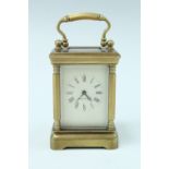 A mid 20th Century diminutive brass carriage clock, key wind and set, the case having hexagonal