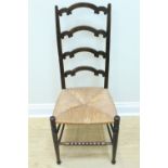 An early 20th Century rush seated ladder back chair