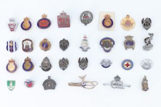 A quantity of military and Home Front lapel badges, sweetheart brooches, etc