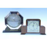 A 1960s brass and mirrored mantle clock, keyless wind and set movement, case formed as an