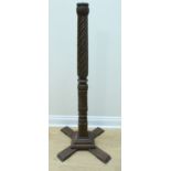 A 1930s turned and carved wood standard lamp, the column having spiral gadrooning and carving, on